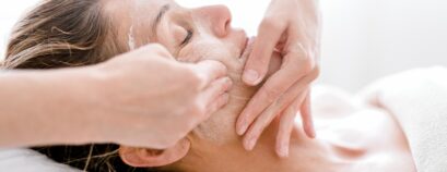 Woman-having-a-relaxing-facial-treatment-at-a-spa