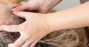 Woman undergoing a hair spa treatment at Earth & Skin