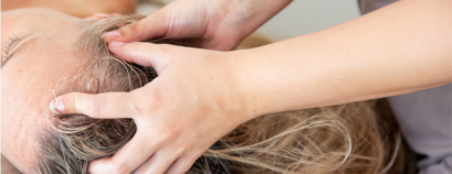Woman undergoing a hair spa treatment at Earth & Skin